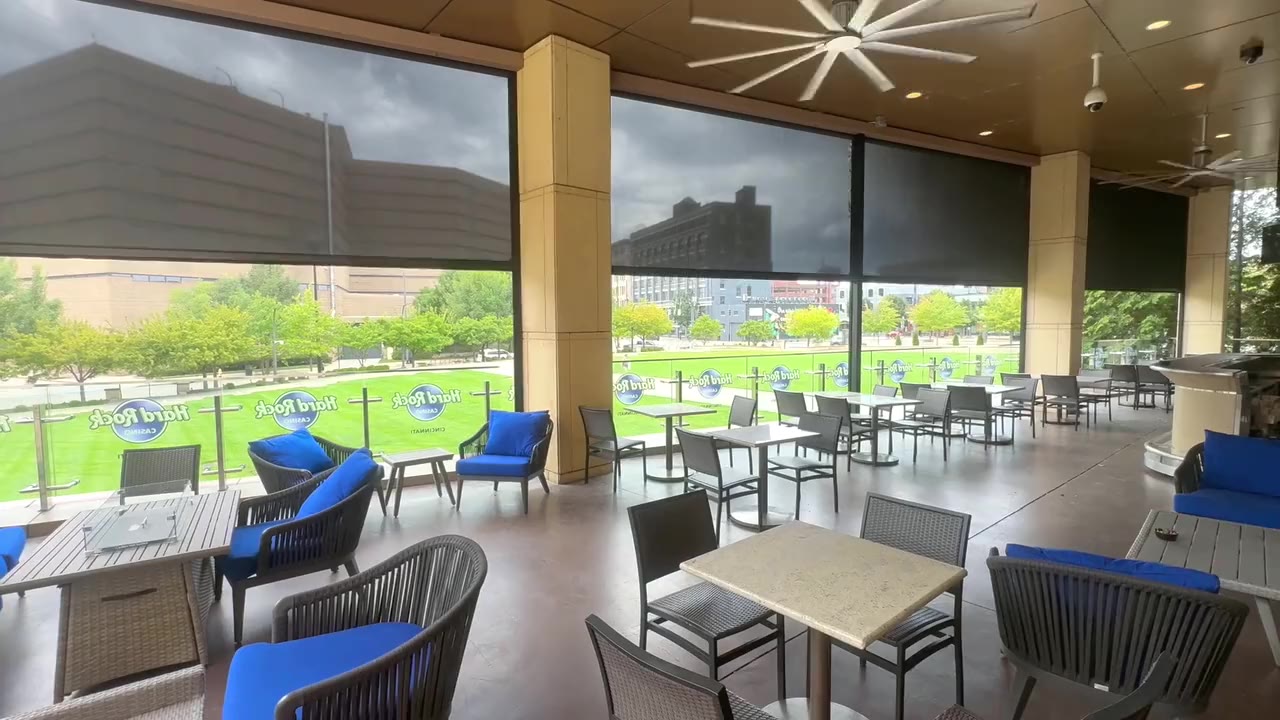 Motorized sun shades lowering on a patio