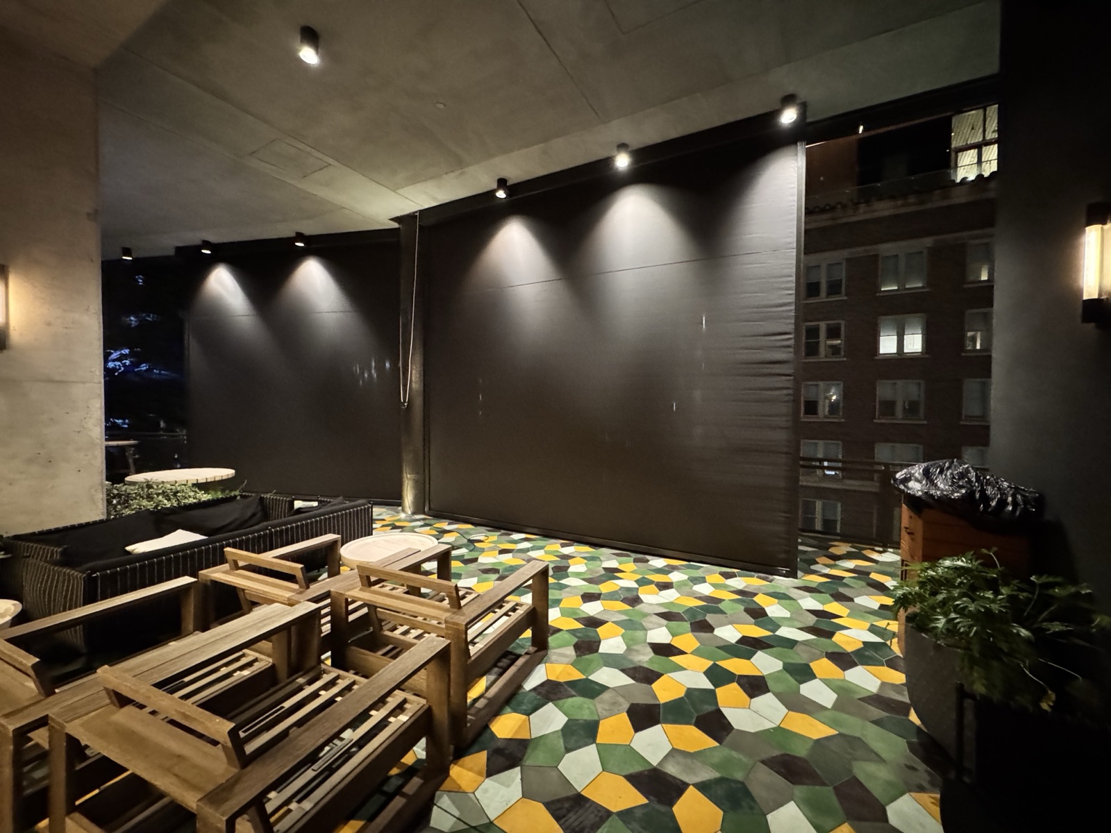 Canopy by Hilton San Antonio: the rooftop patio with the motorized sun shade curtains down at night
