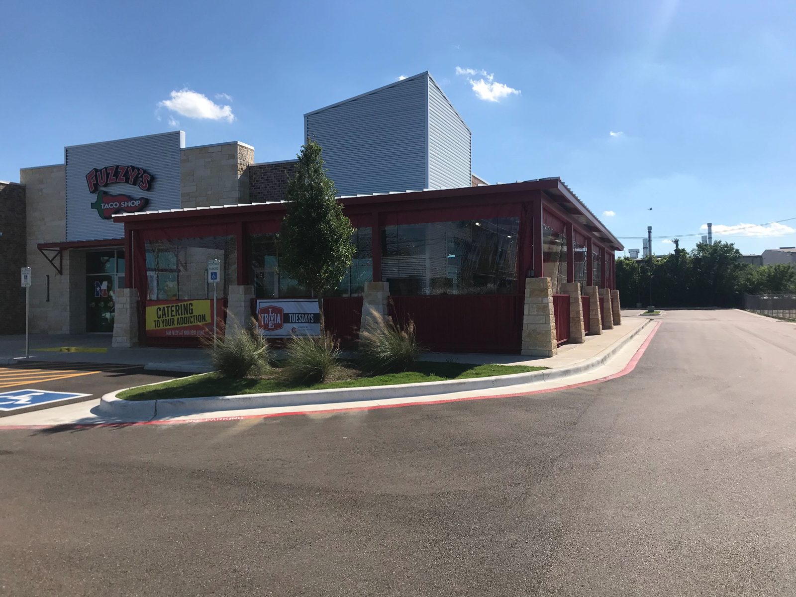 Fuzzy's Hewitt: red-bordered clear manual panels down along the porch under the sign
