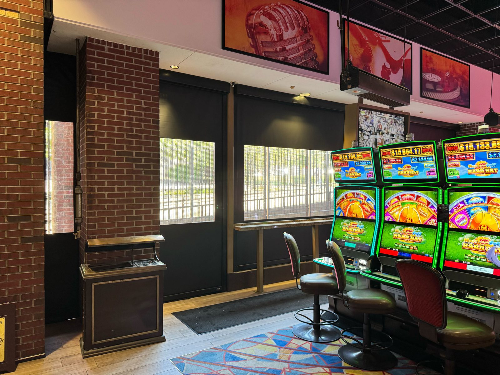 The East gaming patio from the slot floor, shades down over the street-side openings