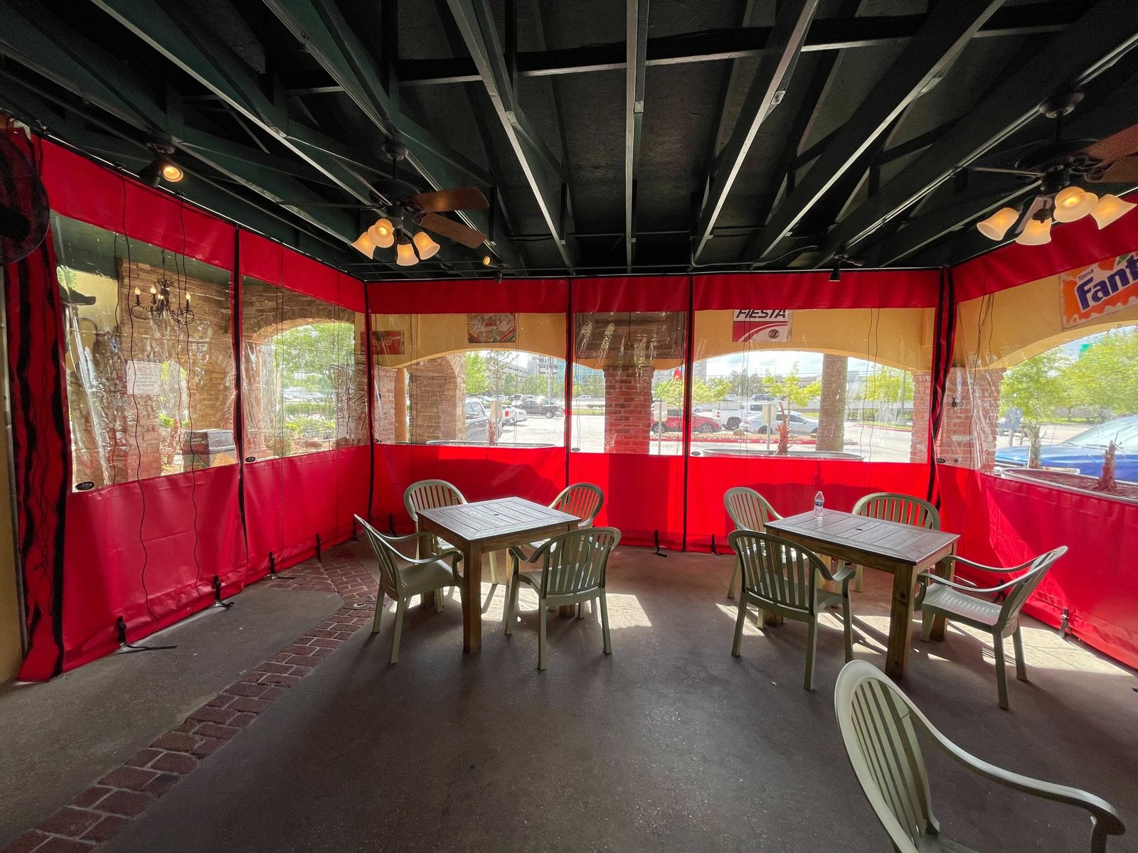 Lupe Tortilla The Woodlands: the patio corner with the panels down, tables set, the fountain and umbrellas outside