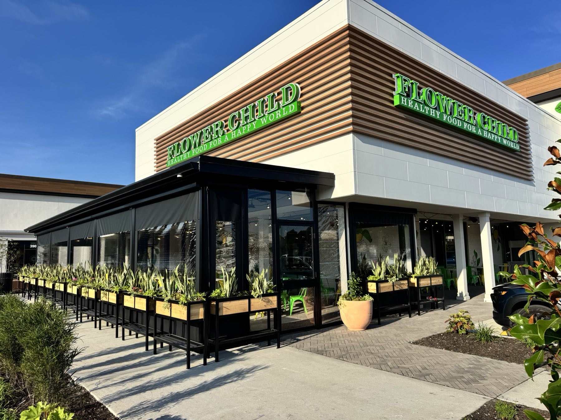 Flower Child restaurant patio enclosed with retractable screens