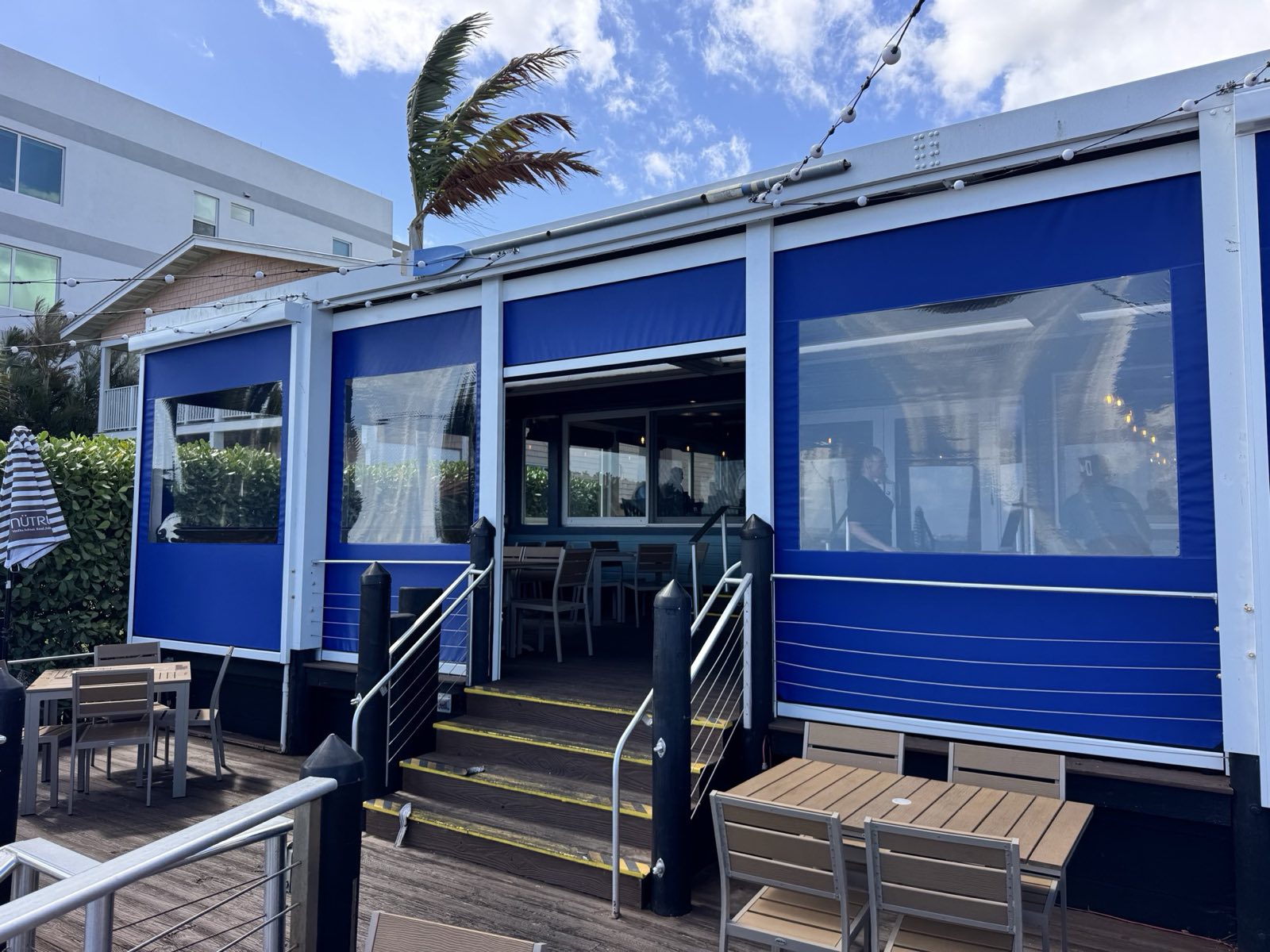 The Boathouse, Stuart FL &mdash; motorized enclosure on a waterfront deck