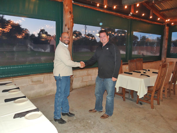 mark shaking joels hand on deck