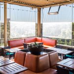 motorized patio screens sun shade material clear vinyl windows rooftop patio del frisco restaurant orange furniture