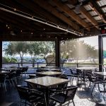 restaurant motorized sun shades lowered jack allens patio austin texas