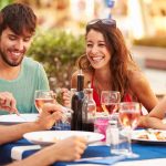 group of friends dining outdoors